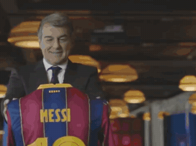 Man In Suit Holding Shirt With Number 10 GIF