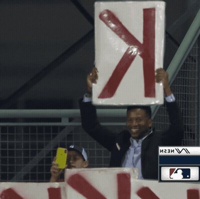 Man In Suit Holding Sign X GIF