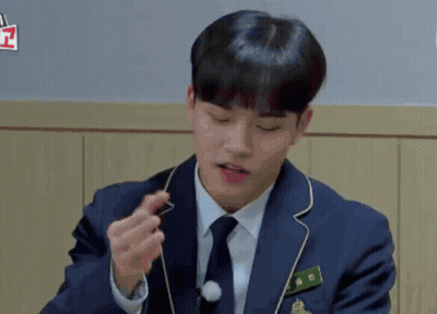 Man In Suit Holding Something GIF