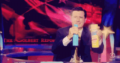 Man In Suit Holding Spray Bottle GIF
