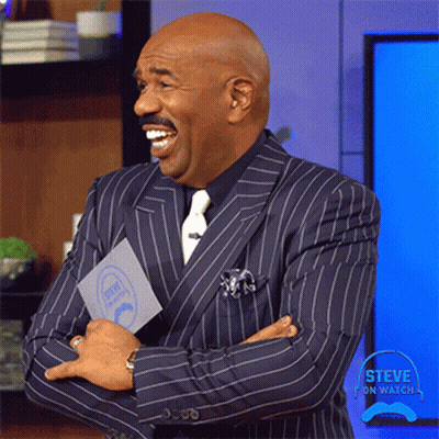 Man In Suit Holding Steve On Watch GIF
