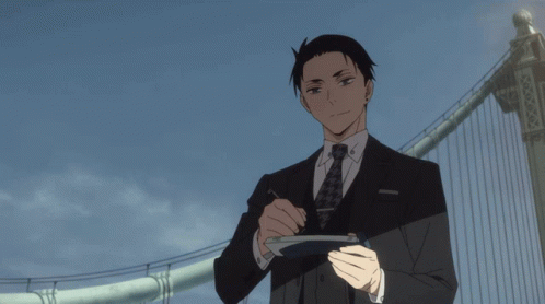 Man In Suit Holding Tokyo Sign GIF
