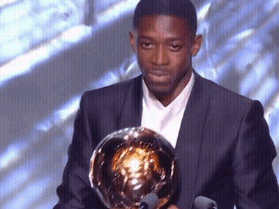 Man In Suit Holding Trophy GIF