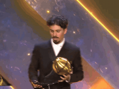 Man In Suit Holding Trophy GIF