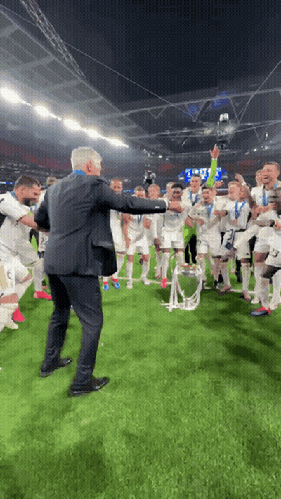 Man In Suit Holding Trophy GIF