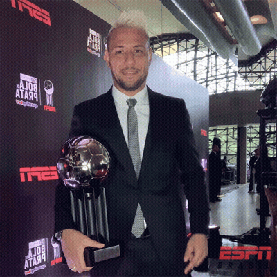 Man In Suit Holding Trophy Tmeb Wall GIF