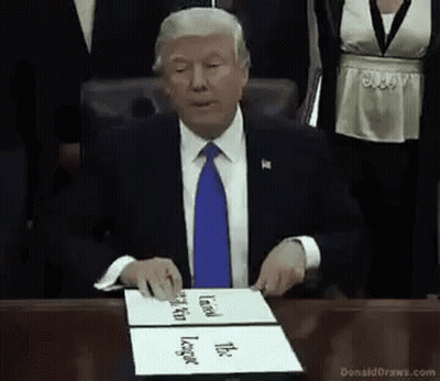 Man In Suit Holding Trophy With Athletes GIF