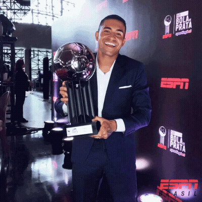 Man In Suit Holding Trophy GIF