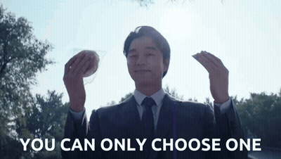 Man In Suit Holding Two Foods You Can Only Choose One GIF