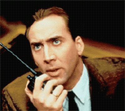 Man In Suit Holding Walkie Talkie GIF