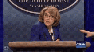 Man In Suit Holding Water Gun At Podium Saying This Is Soapy Water GIF