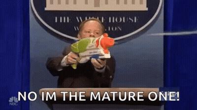 Man In Suit Holding Water Gun Saying No I'm The Mature One GIF