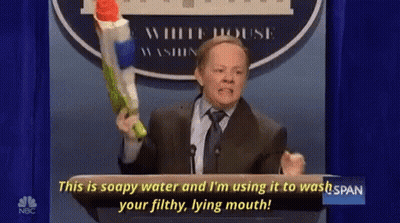 Man In Suit Holding Water Gun Saying This Is Soapy Water GIF