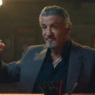 Man In Suit Holding Whiskey Glass GIF