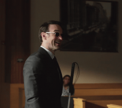 Man In Suit Holding White Cane GIF