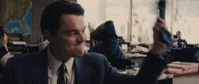 Man In Suit Holding Wine GIF
