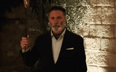 Man In Suit Holding Wine Glass GIF