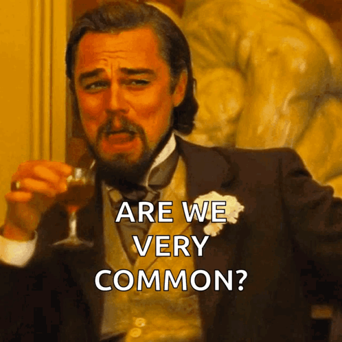 Man In Suit Holding Wine Glass Saying Are We Very Common GIF