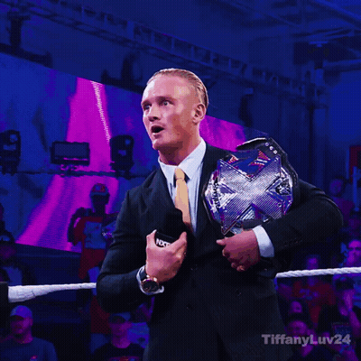 Man In Suit Holding WWE Championship Belt GIF