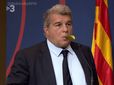 Man In Suit Holding Yellow Object In Mouth With Flag Number 3 GIF