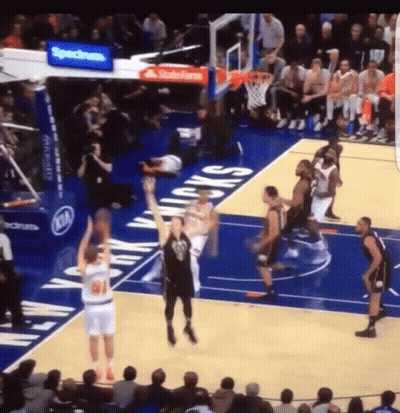 Man In Suit Hugging Another Man In Front Of Flags 2014-2022 GIF