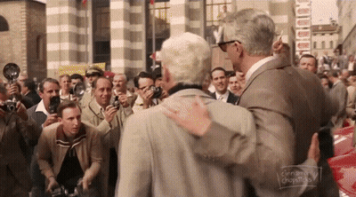 Man In Suit Hugging Man Crowd Cinnamon Chopsticks GIF