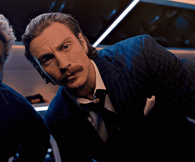 Man In Suit Hugging Man In Wrestling Ring With Flixier GIF