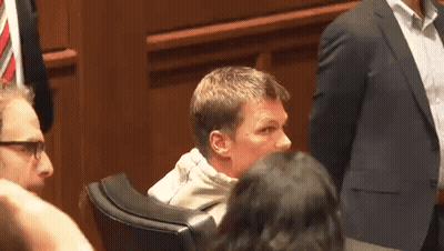 Man In Suit In Courtroom GIF