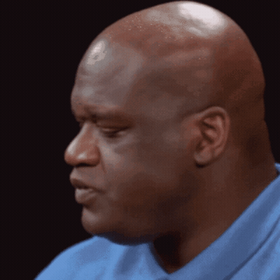 Man In Suit In Dark Room With Backlight GIF
