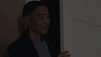 Man In Suit In Doorway GIF