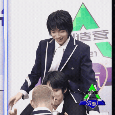 Man In Suit In Front Of 2021 Sign GIF