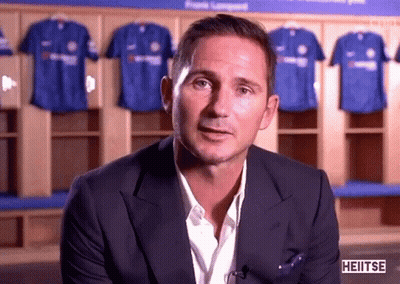 Man In Suit In Front Of Blue Shirts GIF