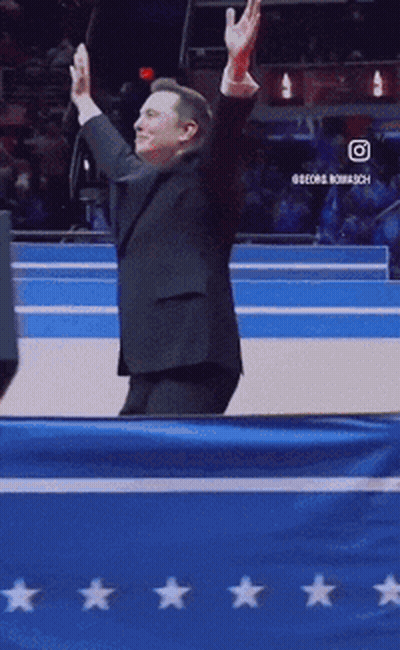 Man In Suit In Front Of Blue Star Flag GIF