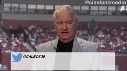 Man In Suit In Front Of Calboy35 Screen GIF