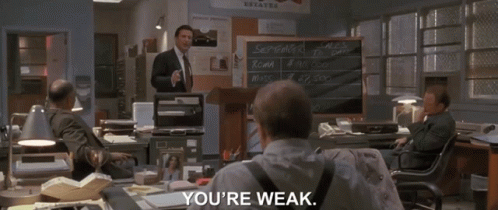 Man In Suit In Front Of Chalkboard Saying September Sales GIF