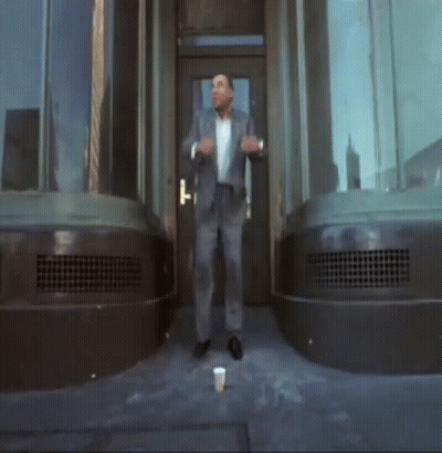 Man In Suit In Front Of Door GIF