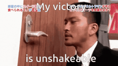 Man In Suit In Front Of Door Saying My Victor Is Unshakeable GIF