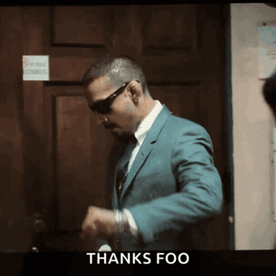 Man In Suit In Front Of Door Saying Thanks Foo GIF
