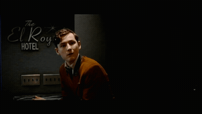 Man In Suit In Front Of El Royale Hotel Sign GIF