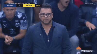 Man In Suit In Front Of Fox Deportes Advertisement GIF