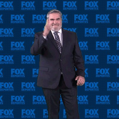 Man In Suit In Front Of Fox Deportes Wall GIF
