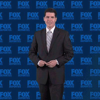 Man In Suit In Front Of Fox Deportes Wall GIF