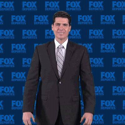 Man In Suit In Front Of Fox Deportes Wall GIF