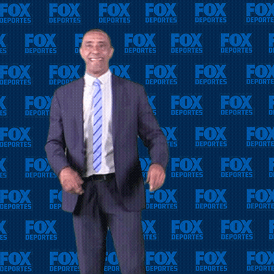 Man In Suit In Front Of Fox Deportes Wall GIF