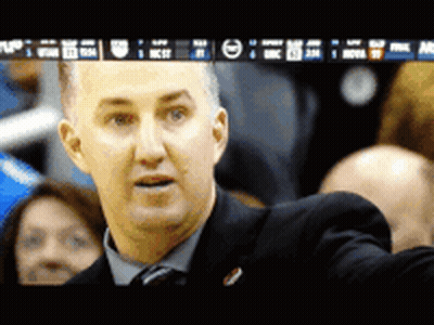 Man In Suit In Front Of NBA Screen GIF