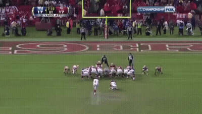 Man In Suit In Front Of NFL Draft Wall GIF
