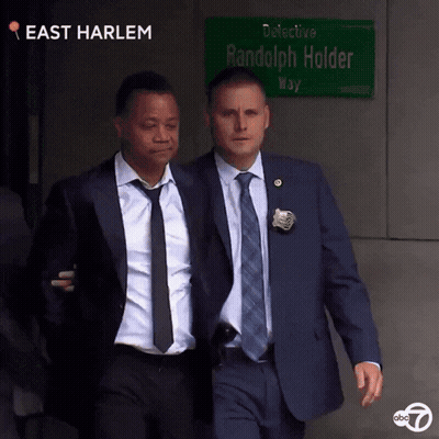 Man In Suit In Front Of Police Lineup 0 To 60 GIF