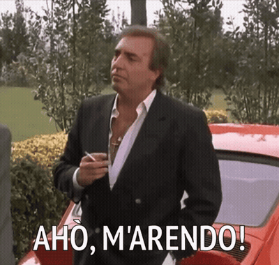 Man In Suit In Front Of Red Car Aho Marendo GIF