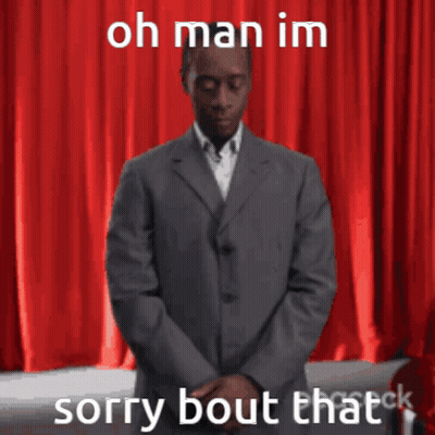 Man In Suit In Front Of Red Curtain Saying Oh Man Im Sorry Bout That GIF