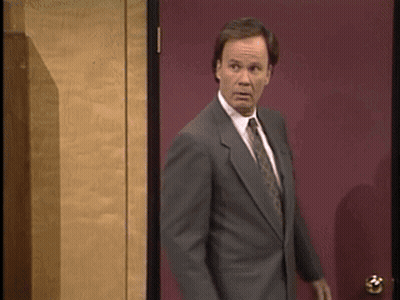 Man In Suit In Front Of Red Door GIF